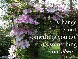 photo of flowers over arbor with quote